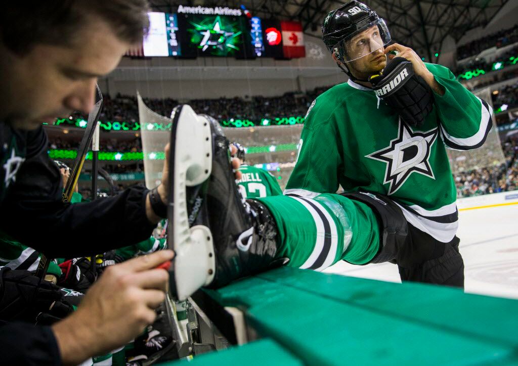 Dallas Stars center Jason Spezza (90) has his skate looked at during the second period of...