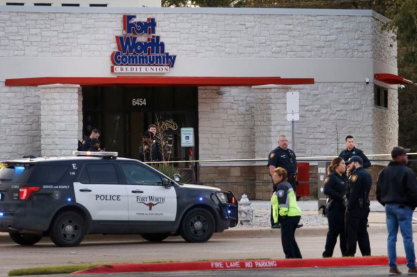 Fort Worth Police officers secure the scene outside the Fort Worth Community Credit Union on...