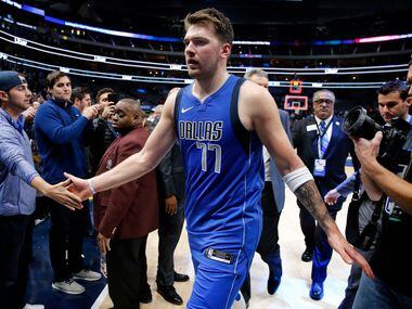 Dallas Mavericks forward Luka Doncic (77) is congratulated by fans after their win over the San Antonio Spurs at the American Airlines Center in Dallas, Monday, November 18, 2019. The Mavericks won, 117-110.