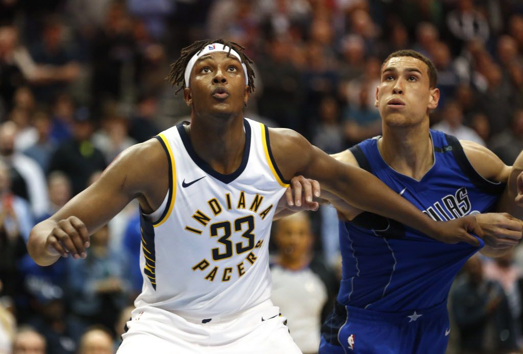 Indiana Pacers center Myles Turner (33) and Dallas Mavericks forward Dwight Powell, right,...