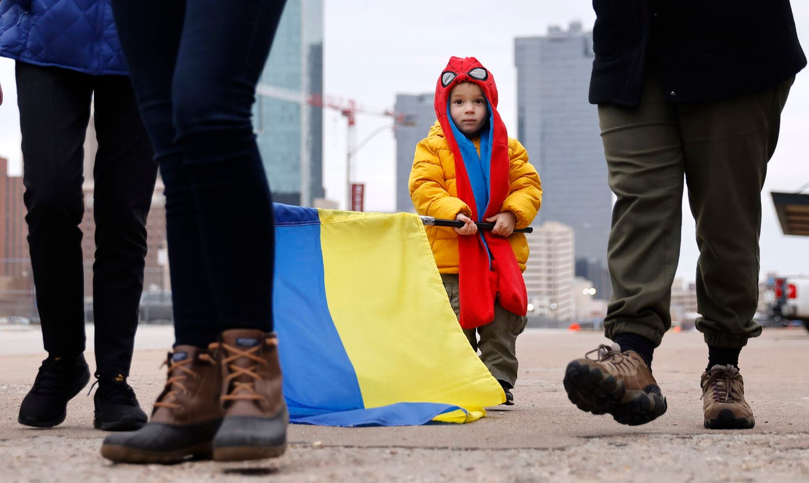 A young boy carried a Ukrainian national flag as a group of supporters gathered in downtown...