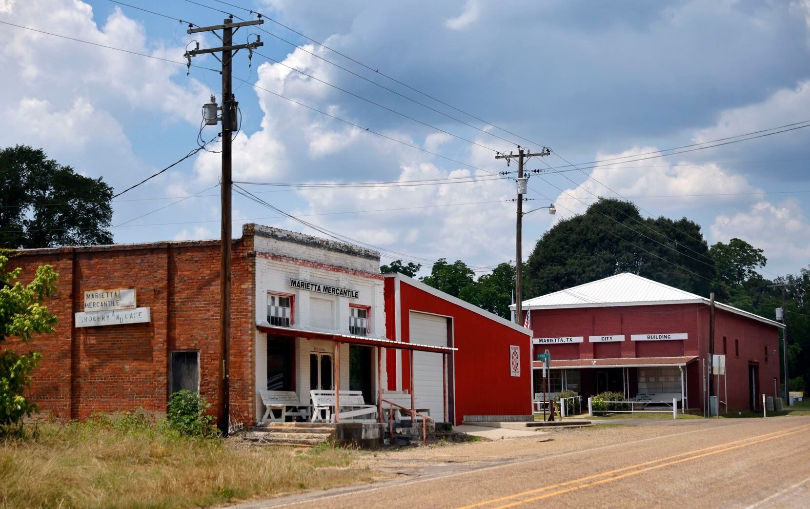 The Marietta city office building (right), volunteer firehouse (center) and old mercantile...