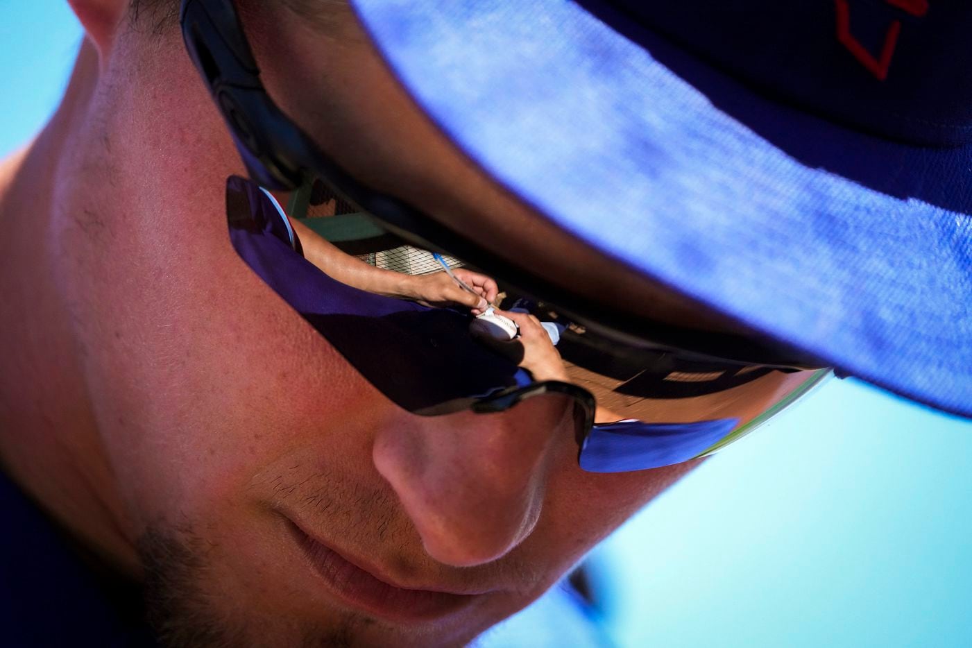 Texas Rangers infielder Corey Seager signs autographs before a spring training game against...