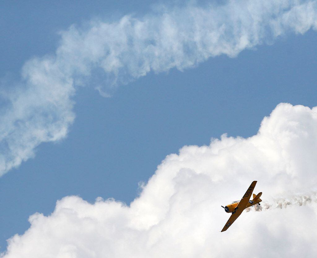 A vintage plane does an aerobatic move during the Flights of Our Fathers Air Show on Saturday.
