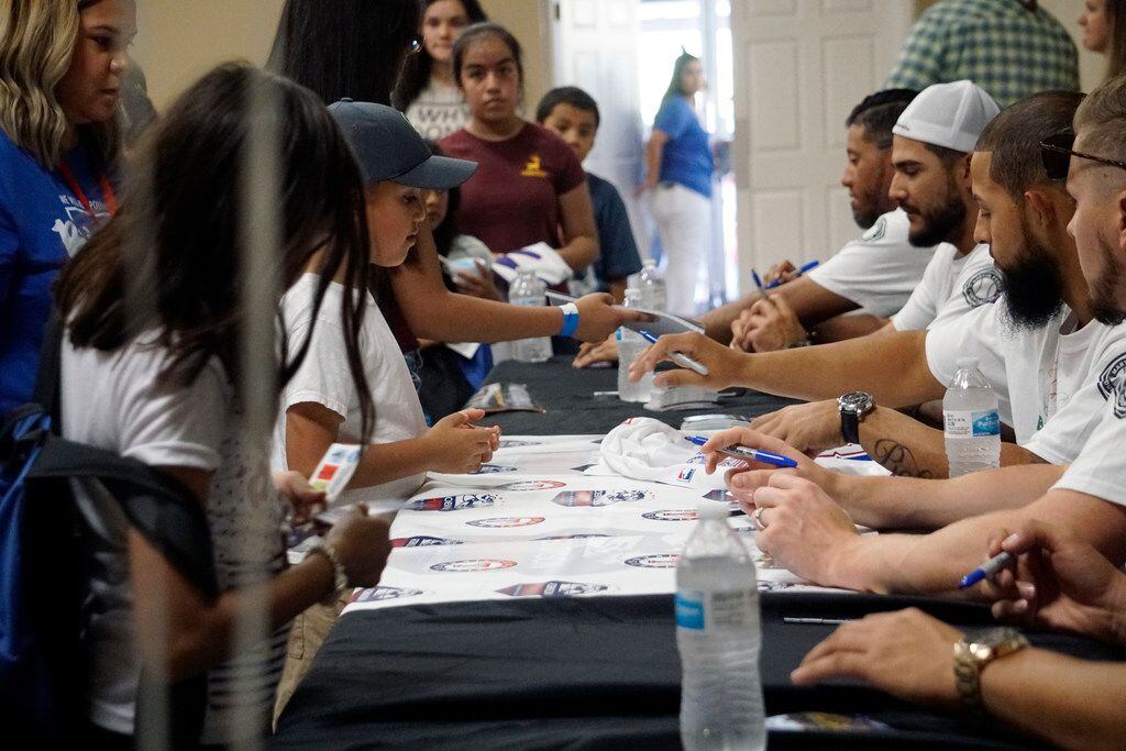 Several Texas Rangers baseball players came out for the Back to School Block Party at Refuge...