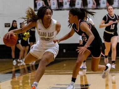 Plano East High School Donavia Hall (23) dribbles the ball up the quart during the second...