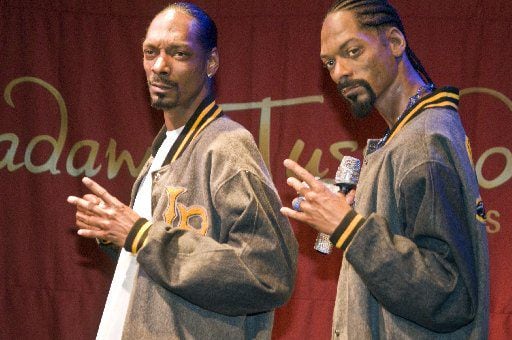 Snoop Dogg, left, stands next to his wax figure at Madame Tussauds Las Vegas. 