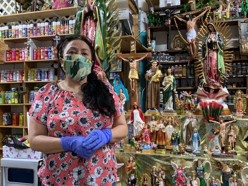 Maribel Marure, who works in northwest Dallas selling religious figurines and candles at her...