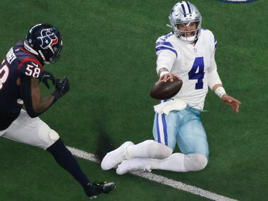 Dallas Cowboys quarterback Dak Prescott (4) slides into the 35 yard line a few yards short...