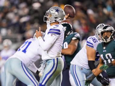 Dallas Cowboys quarterback Dak Prescott (4) throws a pass under pressure from Philadelphia Eagles outside linebacker Patrick Johnson (48) during the second half of an NFL football game at Lincoln Financial Field on Saturday, Jan. 8, 2022.