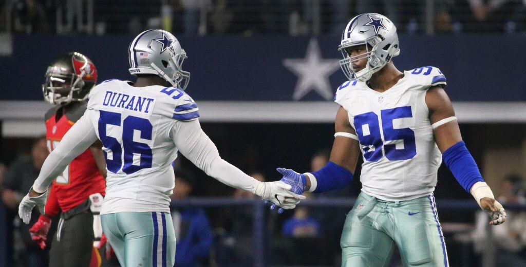 Dallas Cowboys linebacker Justin Durant (56) congratulated Dallas Cowboys defensive tackle...