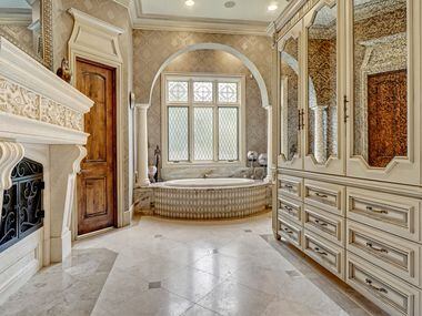 One of two bathrooms attached to the primary suite at 5513 Montclair Drive in Colleyville, TX.