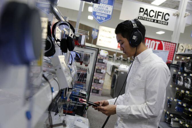 Tom Nuchkasem tried out headphones at Best Buy in Dallas on Monday. Over at RadioShack,...