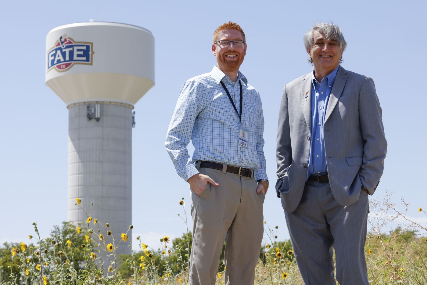 From left: Justin Weiss, assistant city manager of Fate, and Mayor David Billings pose for a...