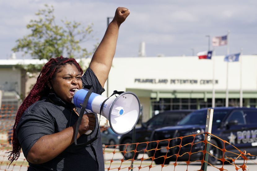 Indianna Taylor was among several supporters and immigrant advocates to protest at the...