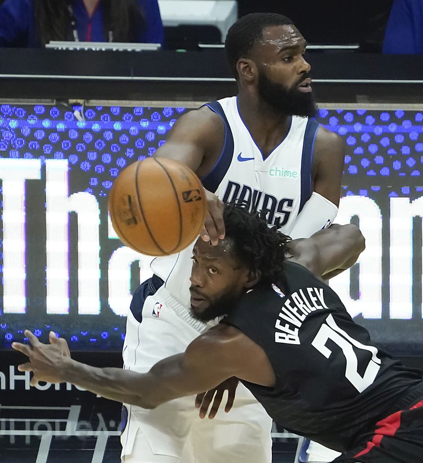 Dallas Mavericks forward Tim Hardaway Jr. (11) tangles with LA Clippers guard Patrick Beverley (21) during the first half of an NBA playoff basketball game at Staples Center on Tuesday, May 25, 2021, in Los Angeles.