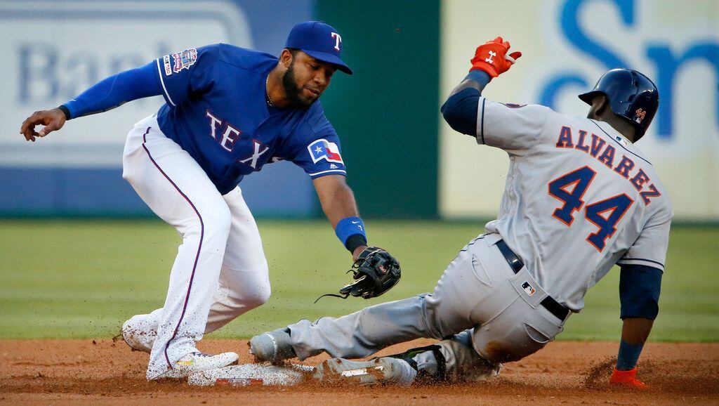 Texas Rangers shortstop Elvis Andrus (1) couldn't get a glove on Houston Astros left fielder...