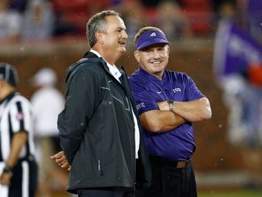 TCU coach Gary Patterson (right) and SMU coach Sonny Dykes talk before a game on Friday, Sept. 7, 2018, in Dallas. (AP Photo/Jim Cowsert)