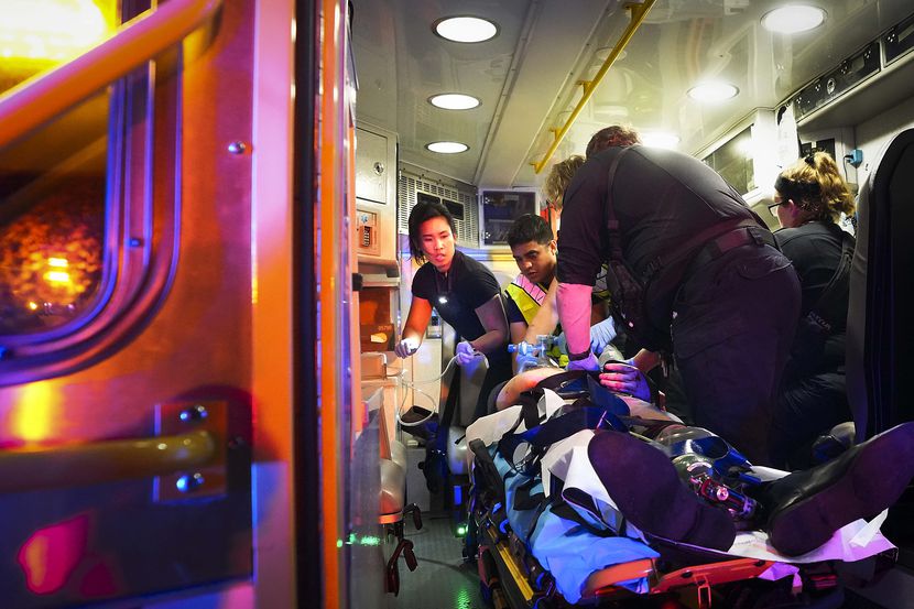 Austin-Travis County EMS medics and Austin firefighters worked on a victim of a motor...