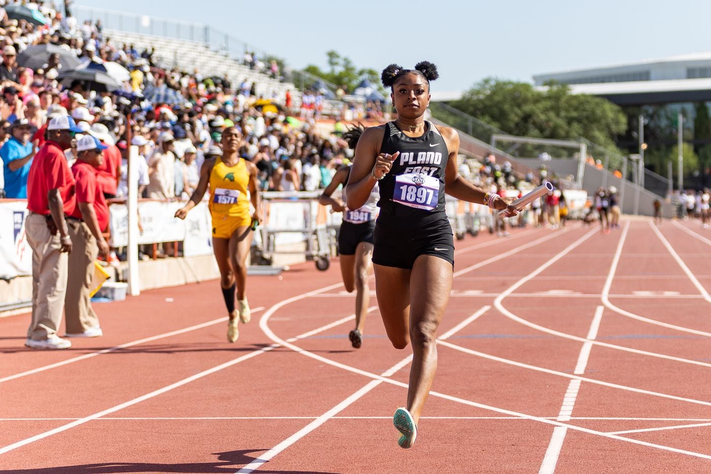 Tiriah Kelley of Plano East runs to a second-place finish in the girls' 4x100-meter relay at...