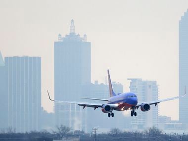 A Southwest Airlines jet plane lines up for a landing at Love Field in Dallas.