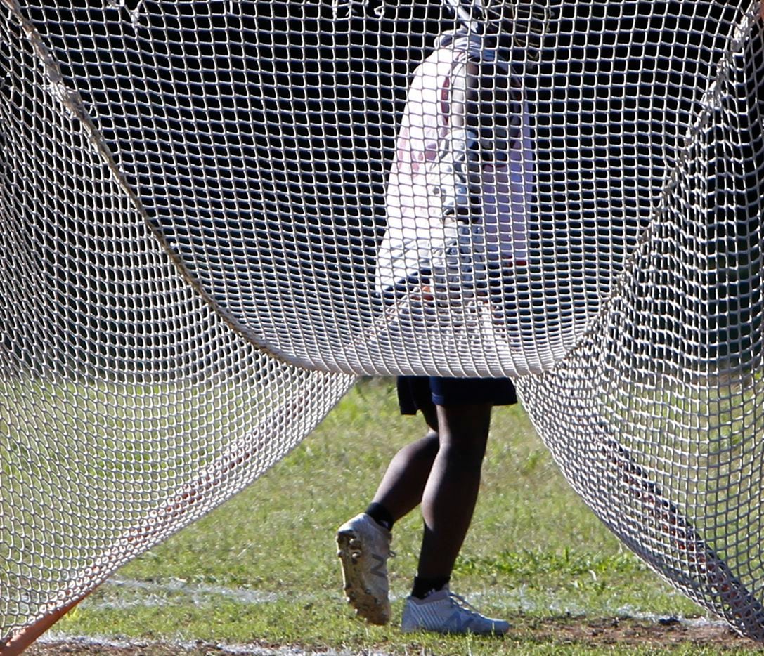 G' Colby Spivey maneuvers a goal into place in preparation for the start of a practice session for the Bridge Eagles lacrosse team. The Bridge lacrosse team held their Wednesday evening practice session at the JC Phelps Recreation Center in Dallas on May 5, 2021.