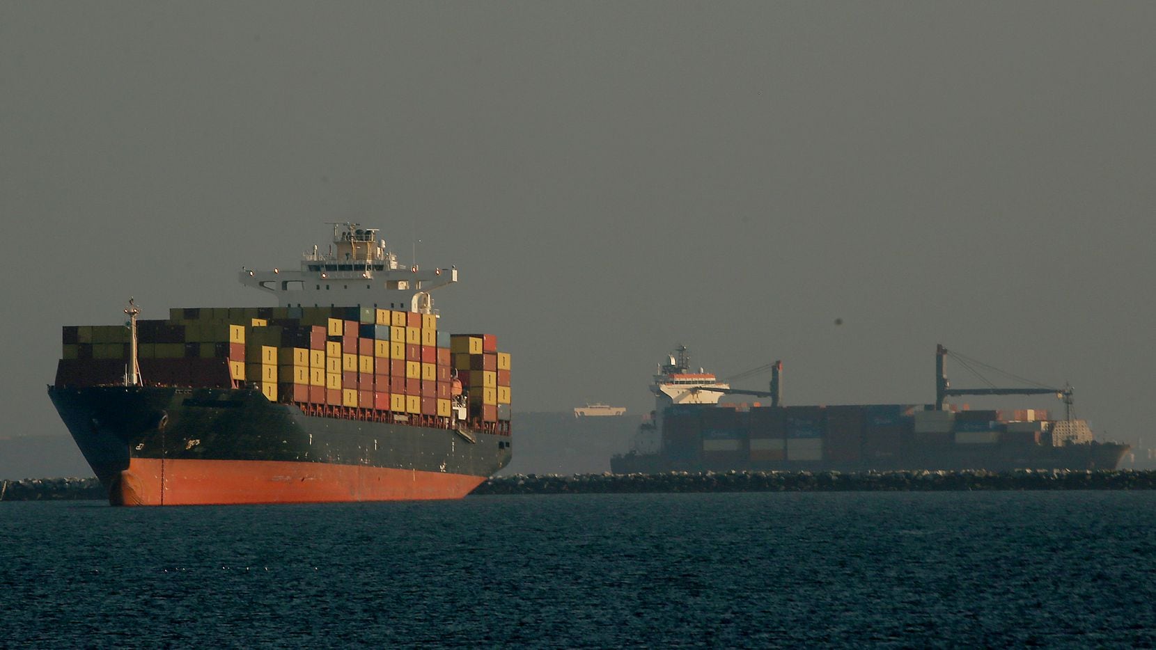 Container ships anchor in the Port of Los Angeles on Wednesday, Dec. 1, 2021. (Luis...
