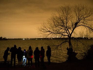 People looking to see if White Rock Lake is haunted, explore the lake with Haunted Rooms in Dallas on Friday, December 14, 2018. The group used various equipment to detect if ghosts were in the area. 