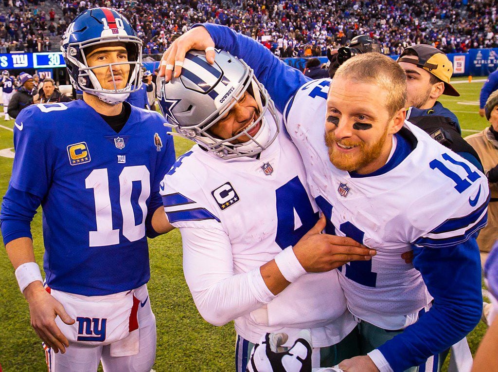 FILE - Cowboys quarterback Dak Prescott (4) celebrates with receiver Cole Beasley (11) after...