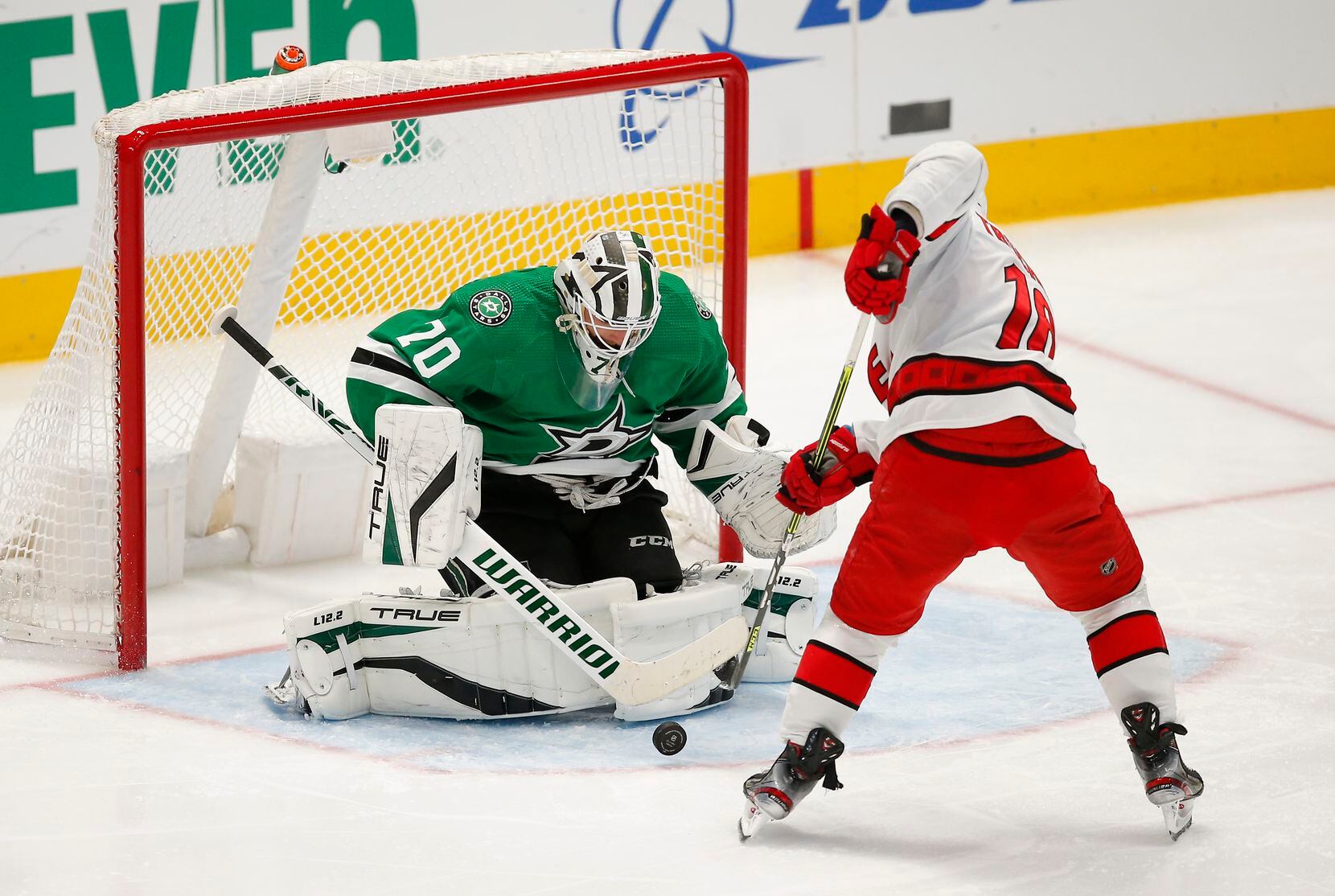 Carolina Hurricanes forward Derek Stepan (18) attempts to play a rebound off of Dallas Stars goaltender Braden Holtby (70) during the second period of an NHL hockey game in Dallas, Tuesday, November 30, 2021. (Brandon Wade/Special Contributor)