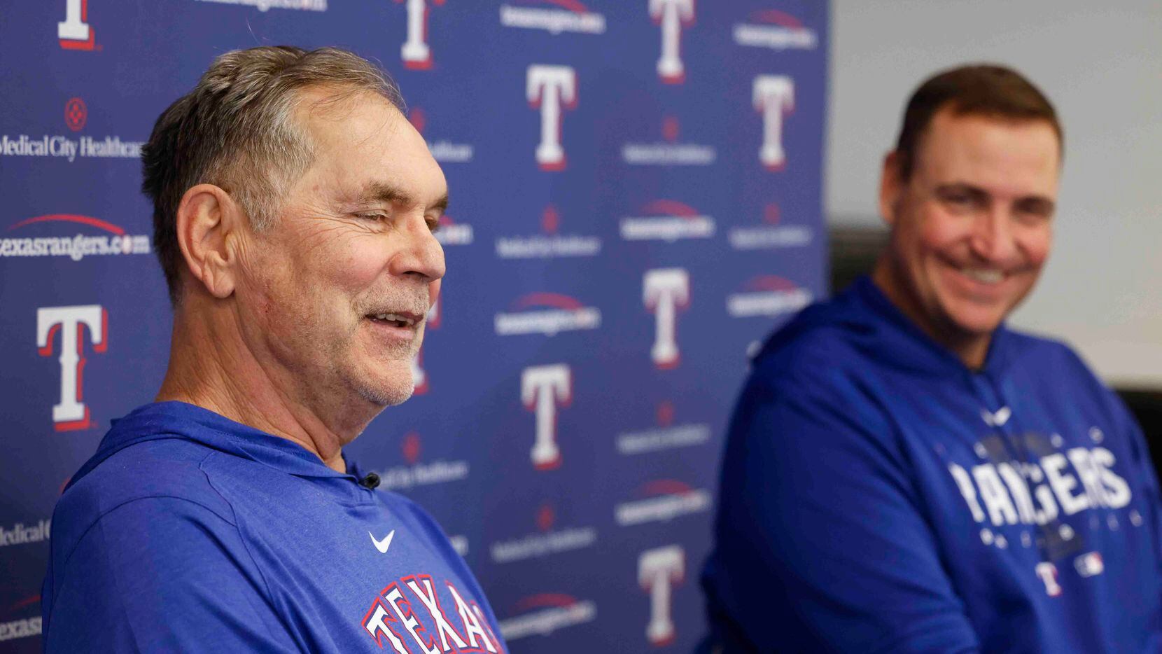 Texas Rangers manager Bruce Bochy, left, and executive vice president and general manager...