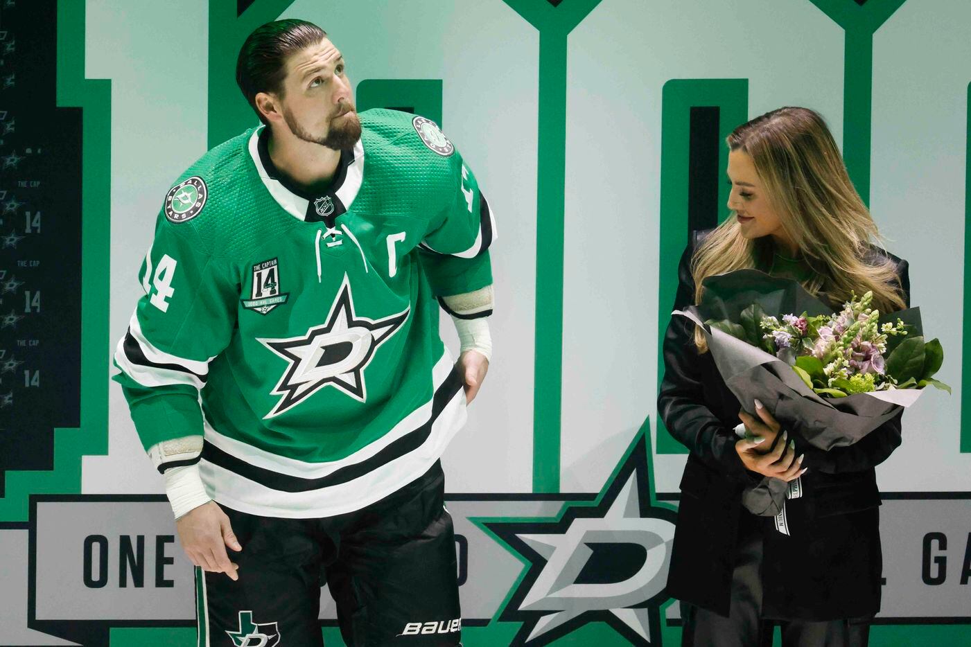 Dallas Stars left wing Jamie Benn (14) stands by his fiancee, Jessica Bennett during a...