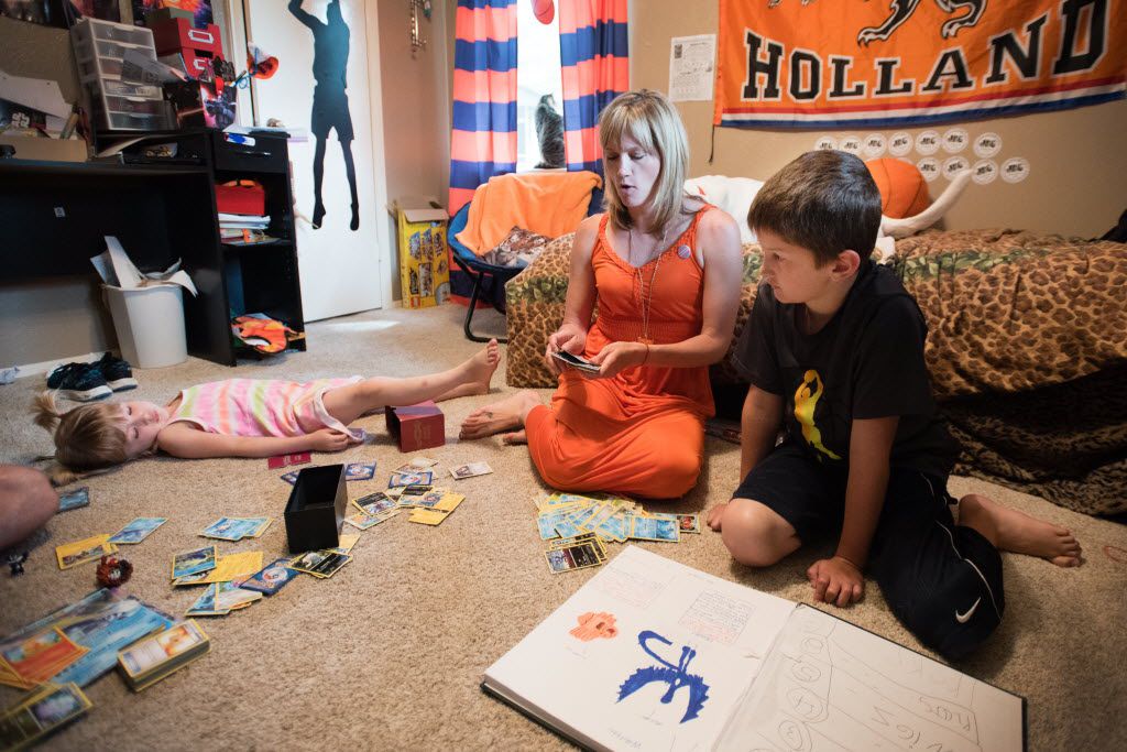 Max Briggle plays with mother, Amber Briggle, and sister, LuLu Briggle, in their Denton home on May 15, 2016.