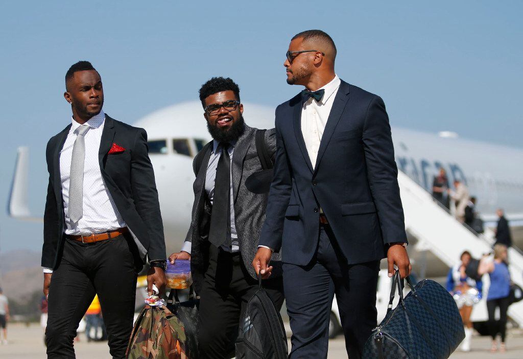 Dallas Cowboys Uzoma Nwachukwu (left) and Dallas Cowboys Dak Prescott (right) look back at...