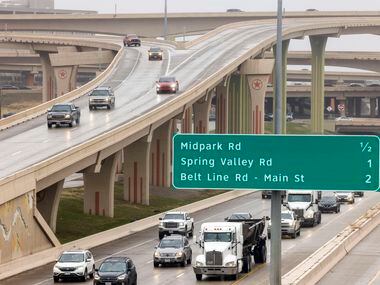 Motorists travel cautiously along southbound U.S. 75 through the High Five interchange at...