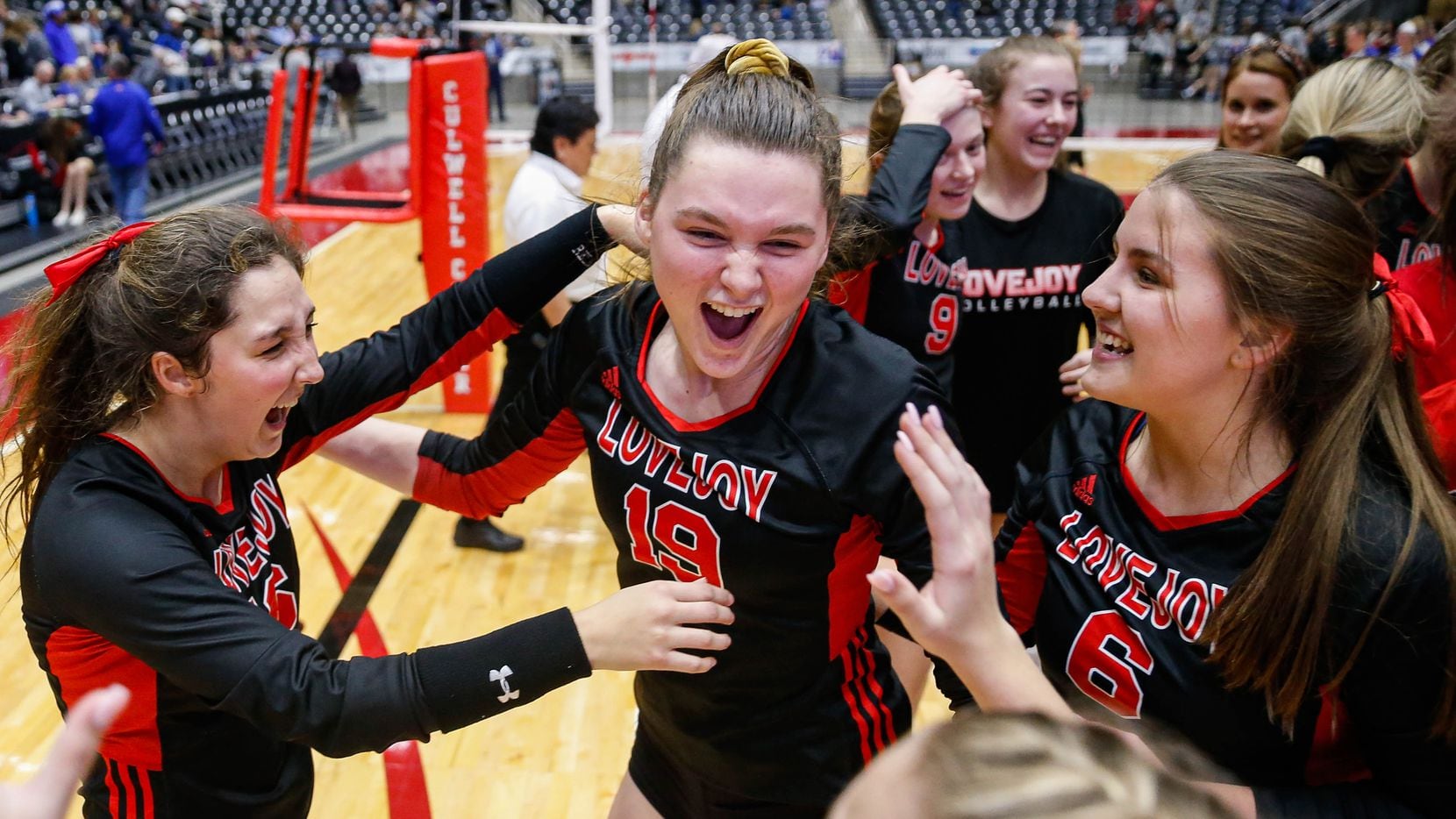 Lovejoy's Lexie Collins (19) (center) celebrates with her team after beating Friendswood in the fourth and final set of a class 5A volleyball state semifinal match at the Curtis Culwell Center in Garland, on Friday, November 22, 2019. Lovejoy advanced to finals after winning the fourth set 25-22. (Juan Figueroa/The Dallas Morning News)
