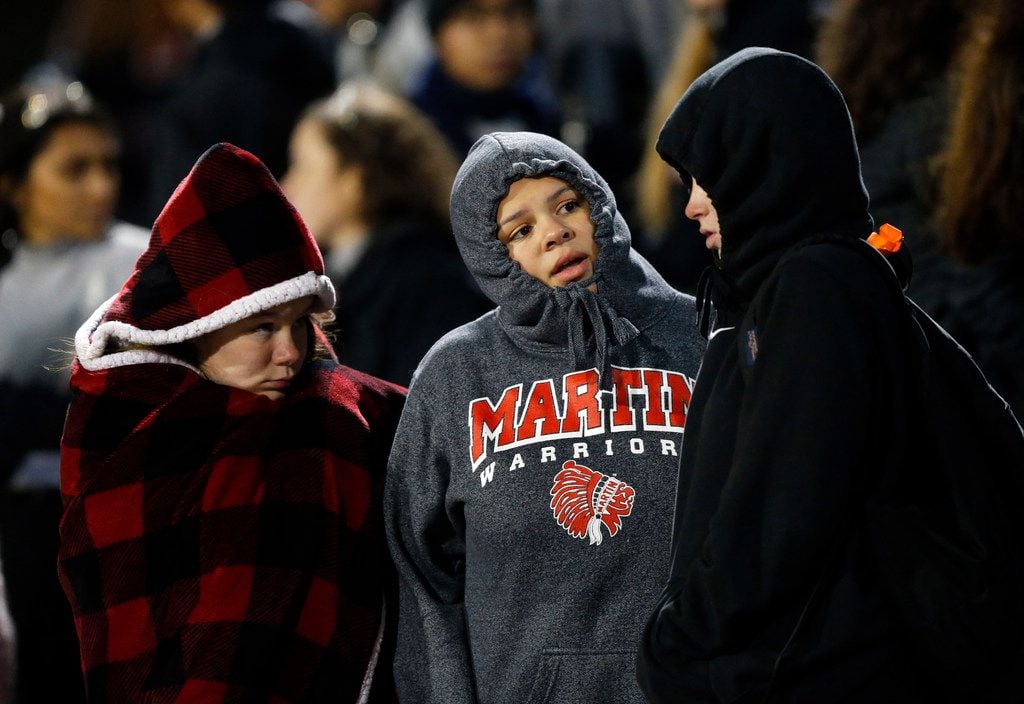 Bundled up Martin Warrior football fans watched the game against Bowie at Maverick Stadium...