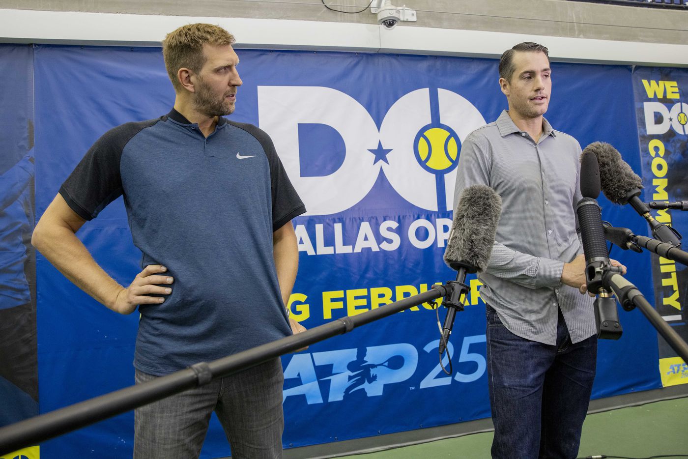 Dallas Mavericks star Dirk Nowitzki (left) listens to John Isner, 15-Time ATP Tour Champion,...