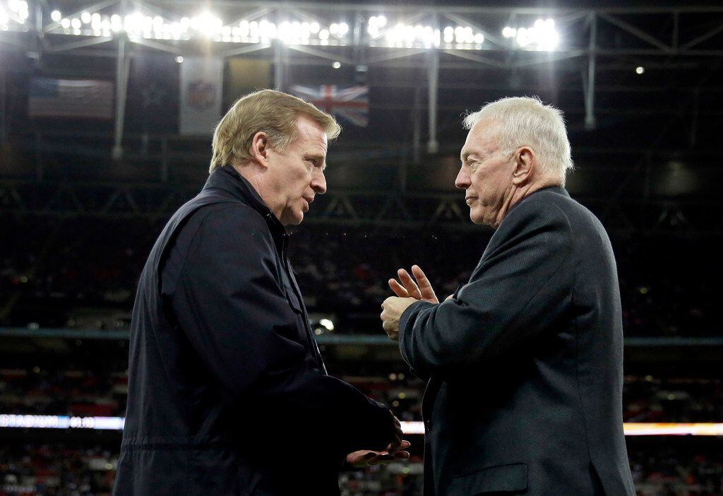 FILE - In this Nov. 9, 2014, file photo, NFL commissioner Roger Goodell, left, and Dallas...