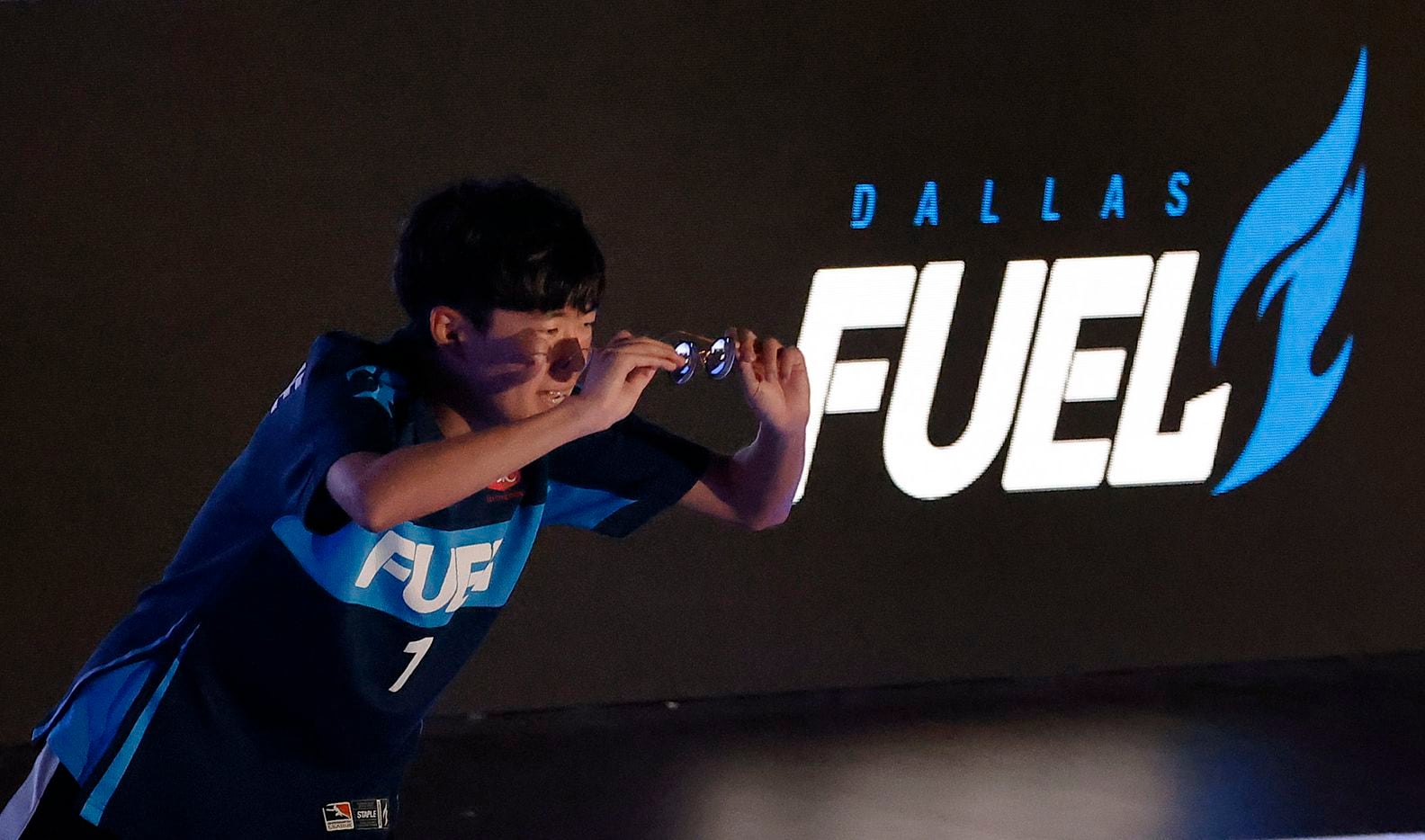 Dallas Fuel player Kim 'Sp9rk1e' Yeonghan acknowledges his fans as he's introduced before their Overwatch League game against the Houston Outlaws at Esports Stadium Arlington Friday, July 9, 2021. Dallas Fuel defeated Houston in The Battle for Texas, 3-0. It was the first in-person live competition for fans in over a year. Houston competed from their hometown. (Tom Fox/The Dallas Morning News)
