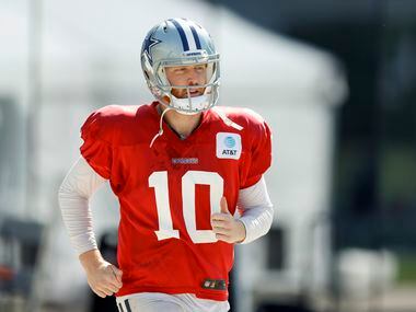 Dallas Cowboys quarterback Cooper Rush (10) jogs to the field during a practice at The Star,...