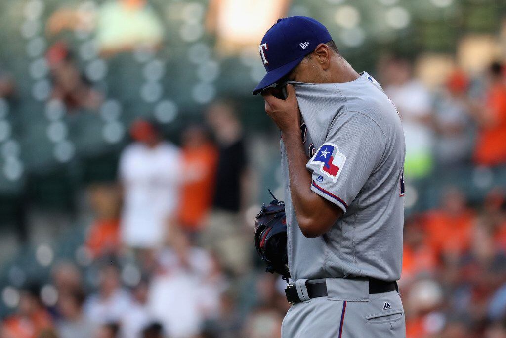 BALTIMORE, MD - JULY 18: Starting pitcher Tyson Ross #44 of the Texas Rangers reacts after...