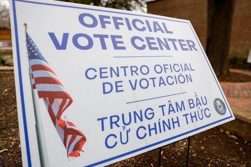 A sign notifies people of a polling location at Lakewood Branch Library in February 2022 in...