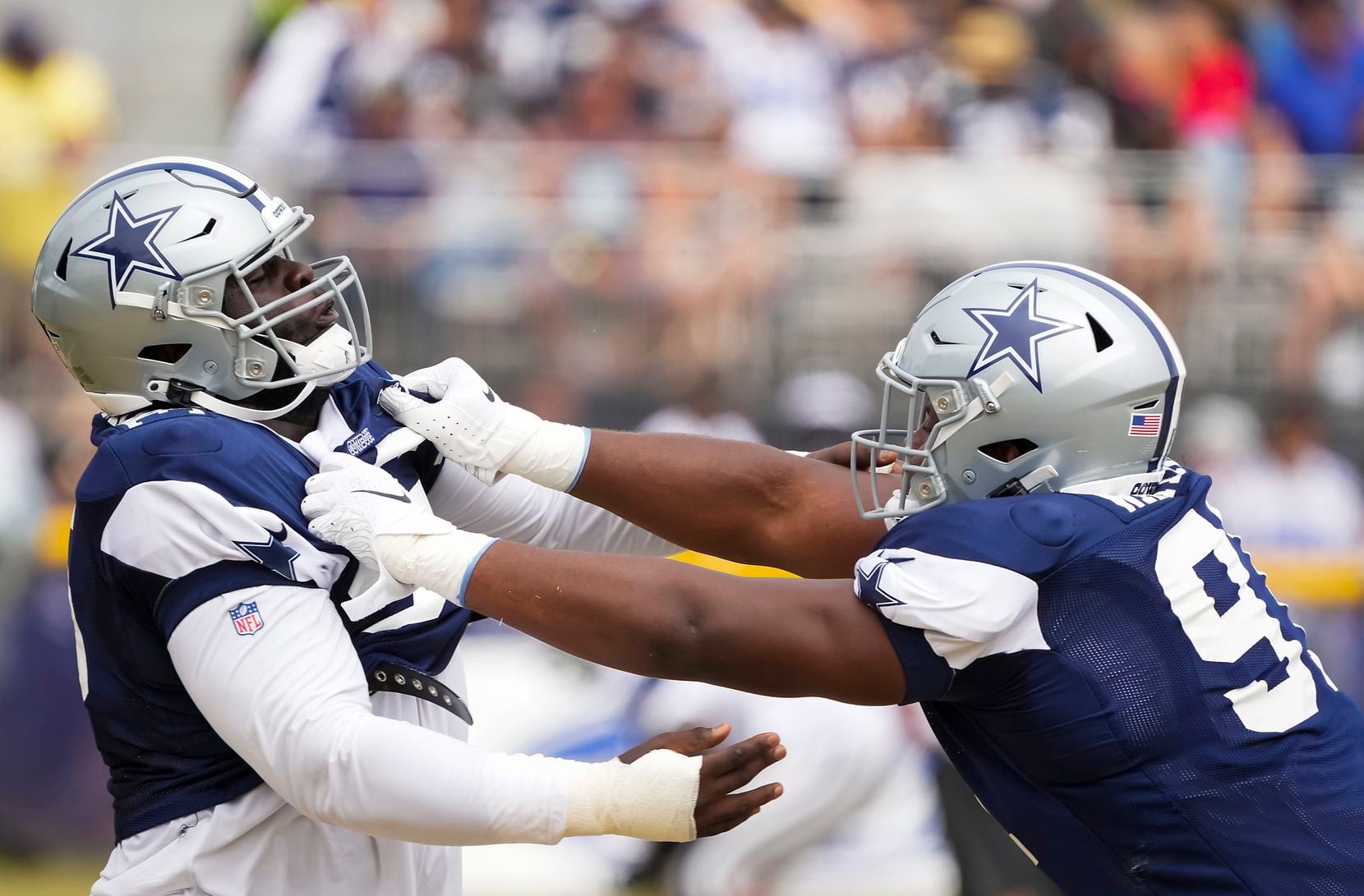 Dallas Cowboys defensive end Carlos Watkins (right) works against defensive tackle Neville Gallimore during a practice at training camp on Saturday, July 31, 2021, in Oxnard, Calif. 