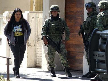 Members of the Mexican Army stand guard outside the U.S. Consulate in Guadalajara, Mexico on...