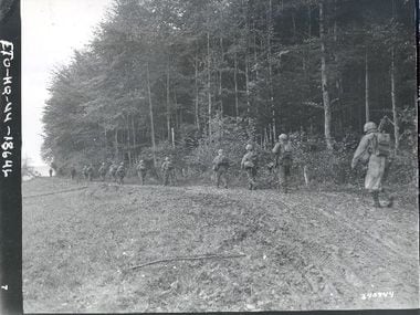 Members of the 442nd Regimental Combat Team head out to relieve the "Lost Battalion" on Oct....