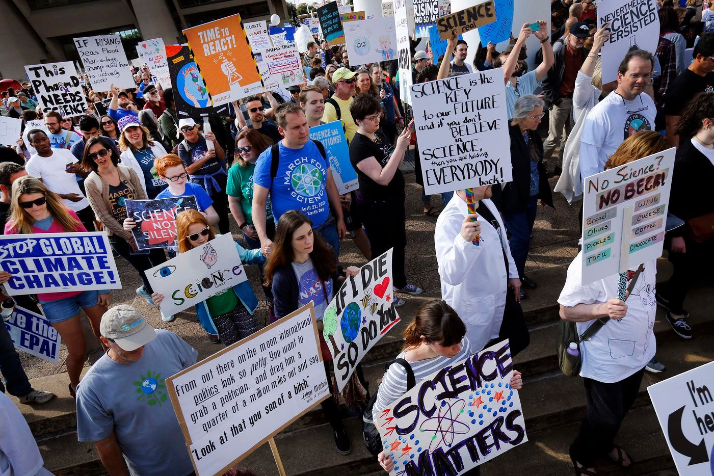 March For Science supporters march from Dallas City Hall as they make their way to Fair...