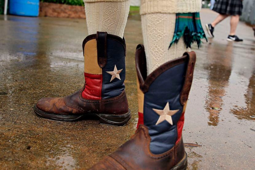 Chuck Newell of Fort Worth stands in a puddle at the Texas Scottish Festival and Highland...