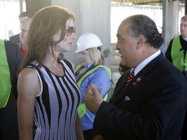 Dallas Cowboys executive vice president Charlotte Jones Anderson talks with Frisco Mayor...