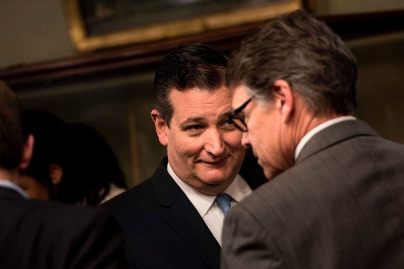 Sen. Ted Cruz and US Secretary of Energy Rick Perry wait for a swearing in ceremony in the...